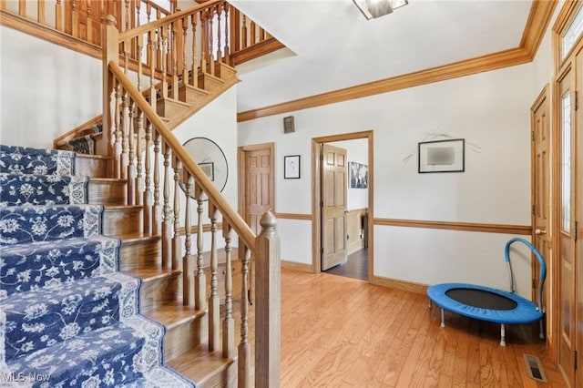 1101 Partridge Dr, Wadsworth, OH 44281 - staircase featuring hardwood / wood-style flooring and ornamental molding