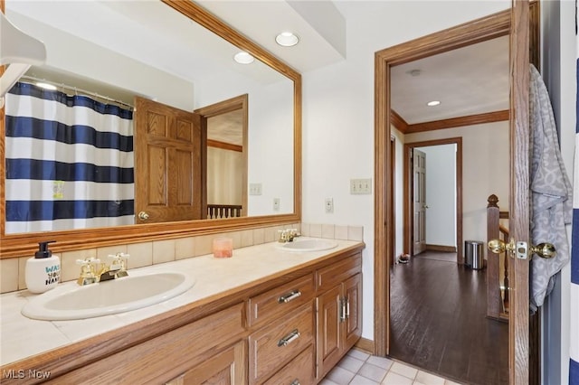 1101 Partridge Dr, Wadsworth, OH 44281 - bathroom featuring double vanity, crown molding, recessed lighting, and tile patterned flooring