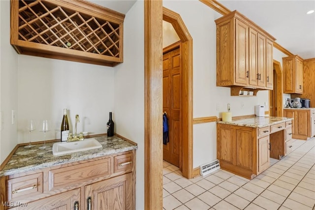 1101 Partridge Dr, Wadsworth, OH 44281 - kitchen featuring light tile patterned floors and light stone counters