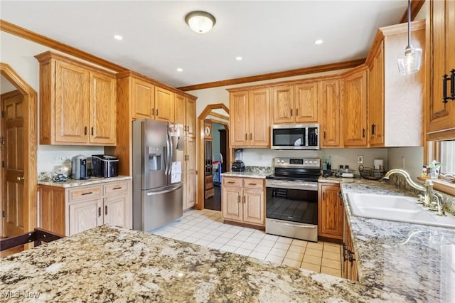 1101 Partridge Dr, Wadsworth, OH 44281 - kitchen with stainless steel appliances, light tile patterned floors, light stone countertops, decorative light fixtures, and crown molding