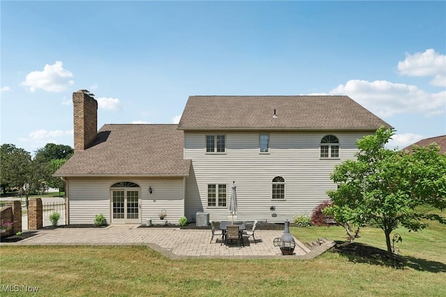 1101 Partridge Dr, Wadsworth, OH 44281 - rear view of property with a chimney and a patio area