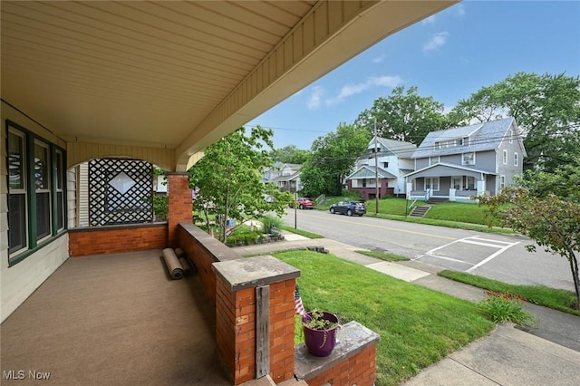 517 Broad Ave NW, Canton, OH 44708 - porch with a yard and a residential view