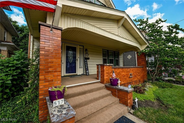 517 Broad Ave NW, Canton, OH 44708 - property entrance with a porch and brick siding