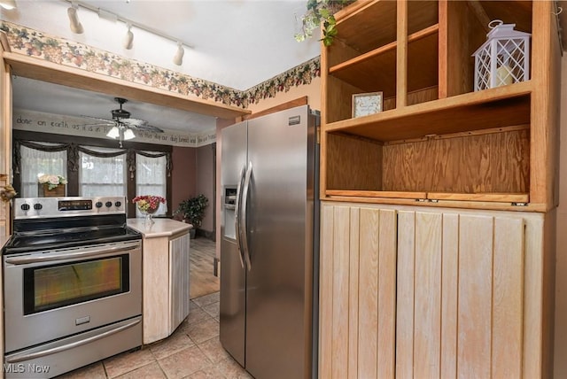 517 Broad Ave NW, Canton, OH 44708 - kitchen featuring appliances with stainless steel finishes, a ceiling fan, light tile patterned floors, and rail lighting