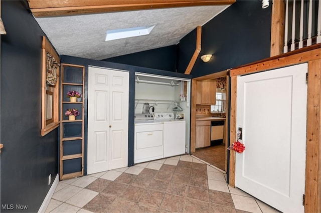 517 Broad Ave NW, Canton, OH 44708 - washroom with washing machine and dryer, light tile patterned floors, and a skylight