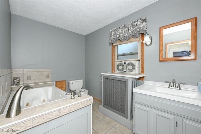 517 Broad Ave NW, Canton, OH 44708 - full bath with vanity, a tub with jets, tile patterned floors, and a textured ceiling