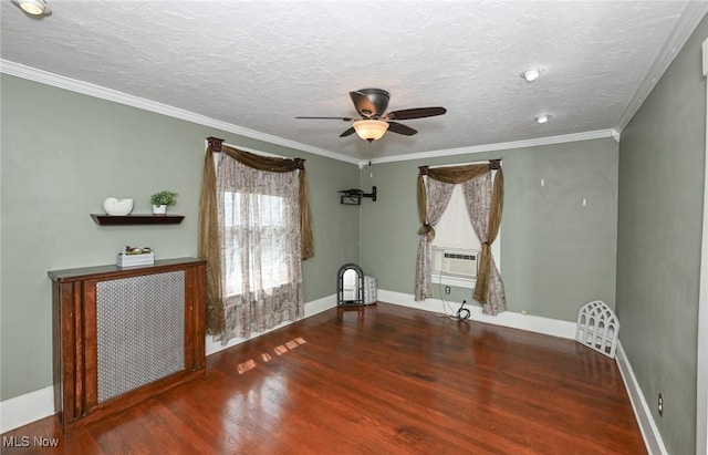 517 Broad Ave NW, Canton, OH 44708 - spare room featuring wood finished floors, a ceiling fan, crown molding, a textured ceiling, and cooling unit