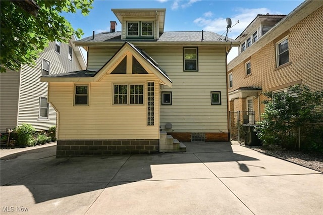 517 Broad Ave NW, Canton, OH 44708 - rear view of property featuring a patio area and a shingled roof