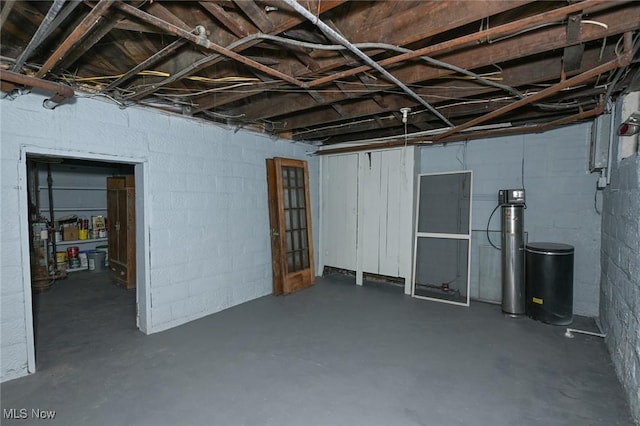 517 Broad Ave NW, Canton, OH 44708 - unfinished below grade area featuring concrete block wall and a water softener system