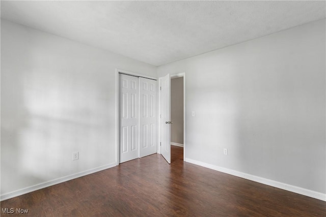 254 Eastern Rd, Doylestown, OH 44230 - unfurnished bedroom featuring wood finished floors and a closet
