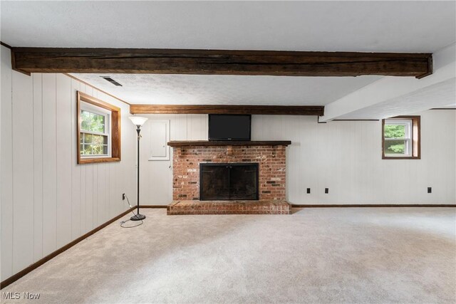 254 Eastern Rd, Doylestown, OH 44230 - unfurnished living room with carpet floors, beamed ceiling, a brick fireplace, and wooden walls