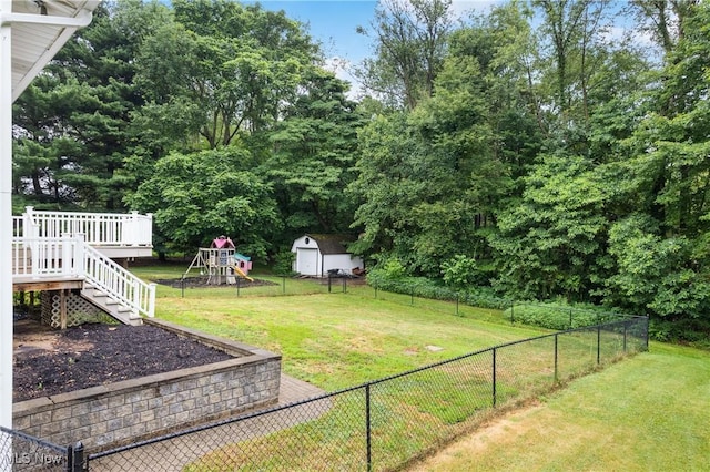 254 Eastern Rd, Doylestown, OH 44230 - fenced backyard with a playground, a storage shed, a wooden deck, and stairs