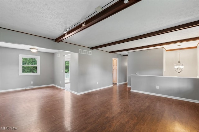 254 Eastern Rd, Doylestown, OH 44230 - spare room featuring wood finished floors, a chandelier, beam ceiling, and a textured ceiling