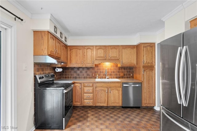 254 Eastern Rd, Doylestown, OH 44230 - kitchen with stainless steel appliances, under cabinet range hood, tasteful backsplash, crown molding, and light countertops