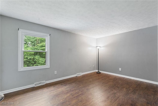 254 Eastern Rd, Doylestown, OH 44230 - unfurnished room with wood finished floors and a textured ceiling