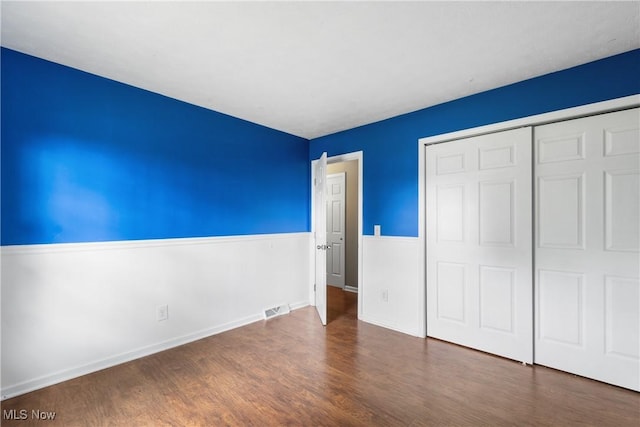 254 Eastern Rd, Doylestown, OH 44230 - unfurnished bedroom with wood finished floors and a closet