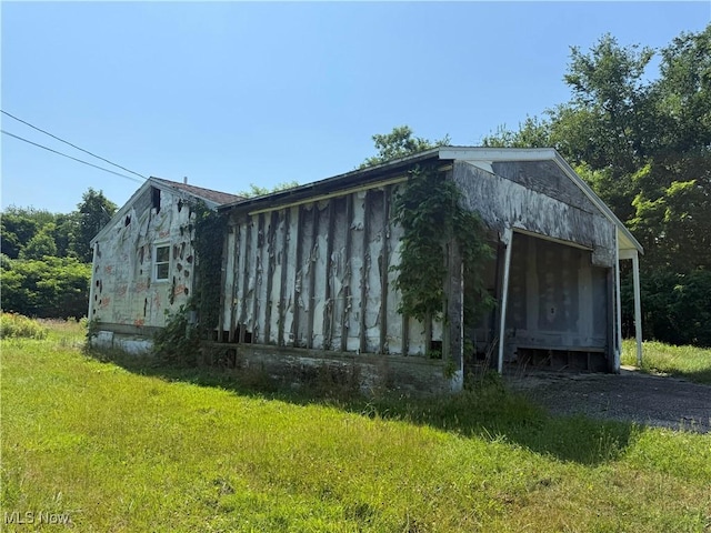 3066 State Route 7 N, Pierpont, OH 44082 - view of side of home featuring a lawn