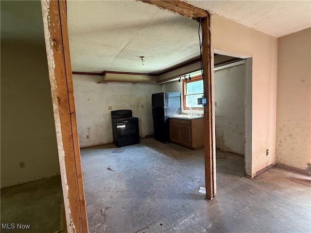 3066 State Route 7 N, Pierpont, OH 44082 - below grade area with freestanding refrigerator and a textured ceiling