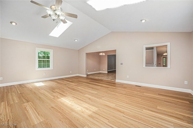 11801 Quail Crest Ave, Mantua, OH 44255 - unfurnished room with ceiling fan, light wood-style floors, lofted ceiling, and a skylight