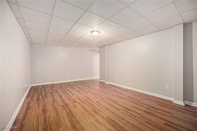 11801 Quail Crest Ave, Mantua, OH 44255 - empty room with wood finished floors and a paneled ceiling