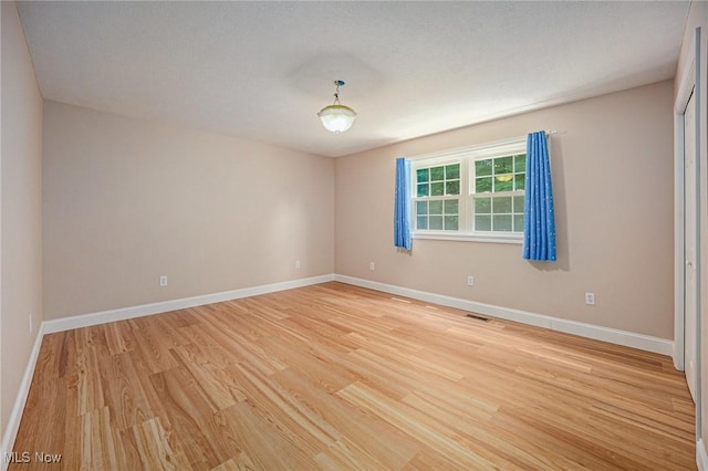 11801 Quail Crest Ave, Mantua, OH 44255 - unfurnished room featuring light wood finished floors and baseboards