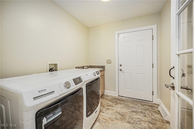 11801 Quail Crest Ave, Mantua, OH 44255 - laundry room featuring washer and clothes dryer and cabinet space