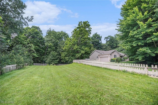 11801 Quail Crest Ave, Mantua, OH 44255 - view of yard with a garage