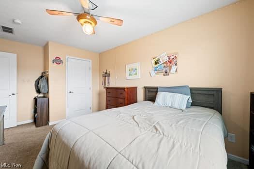 1932 Pinewood Ln, Painesville, OH 44077 - bedroom with carpet floors and a ceiling fan
