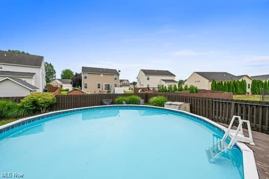 1932 Pinewood Ln, Painesville, OH 44077 - view of pool featuring a fenced backyard and a residential view