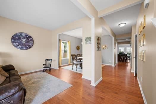 1932 Pinewood Ln, Painesville, OH 44077 - living room with healthy amount of natural light, wood finished floors, and beamed ceiling