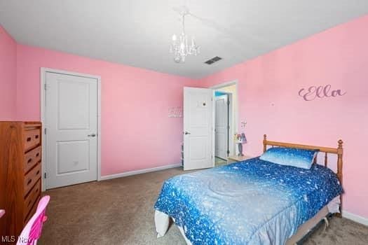 1932 Pinewood Ln, Painesville, OH 44077 - bedroom with carpet and a chandelier