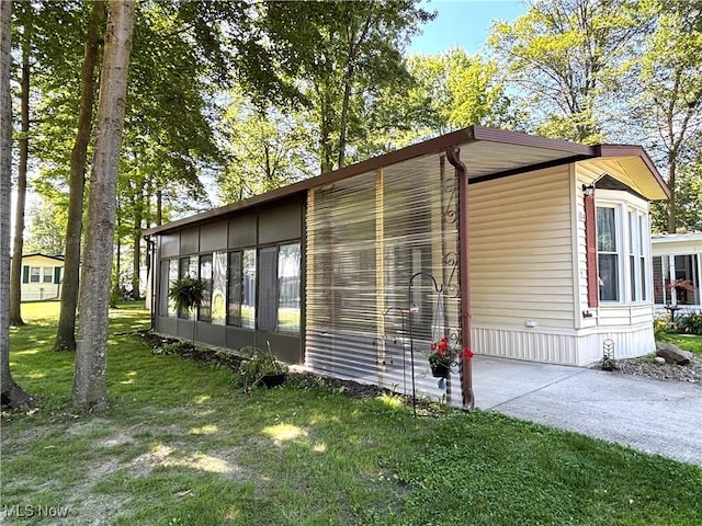 1229 Columbiana Lisbon Rd Unit 104, Columbiana, OH 44408 - view of side of home with a lawn and driveway
