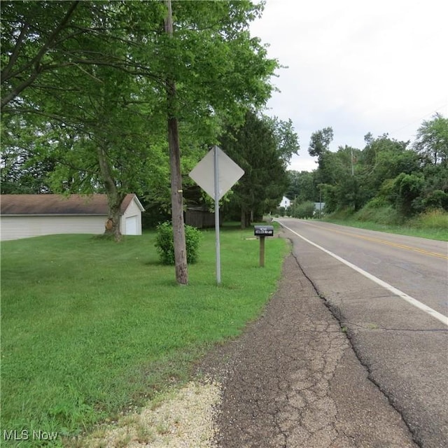 4018 Steubenville Rd SE, Amsterdam, OH 43903 - view of asphalt road featuring traffic signs