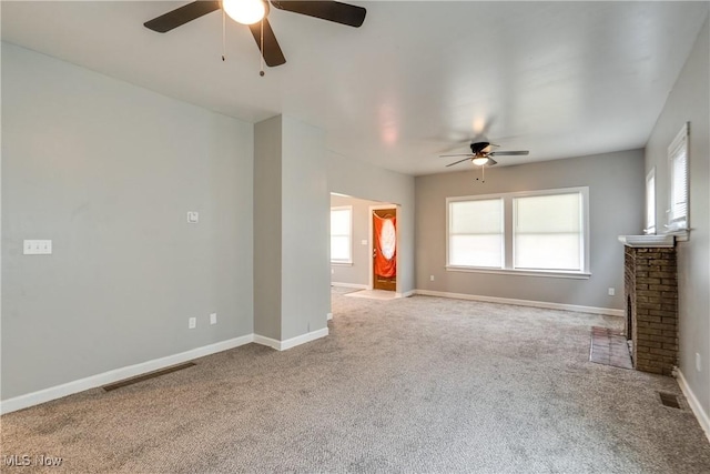 12826 Harvard Ave, Cleveland, OH 44105 - unfurnished living room featuring a ceiling fan, carpet floors, and a fireplace