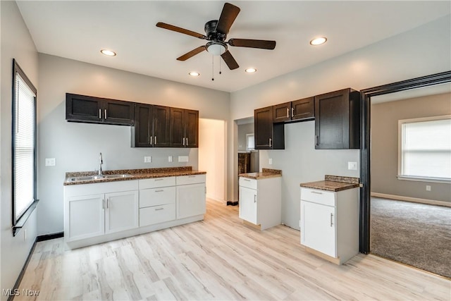 12826 Harvard Ave, Cleveland, OH 44105 - kitchen with a ceiling fan, recessed lighting, light wood finished floors, and dark brown cabinetry