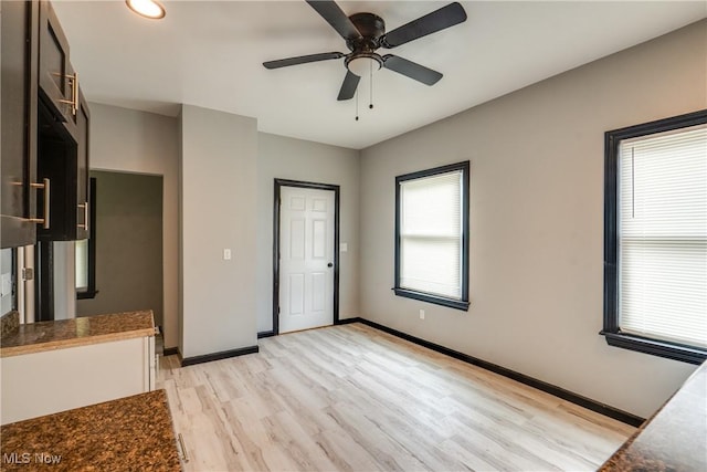 12826 Harvard Ave, Cleveland, OH 44105 - unfurnished living room featuring light wood finished floors, a ceiling fan, and recessed lighting