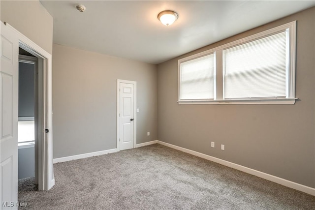 12826 Harvard Ave, Cleveland, OH 44105 - unfurnished bedroom featuring carpet floors and baseboards
