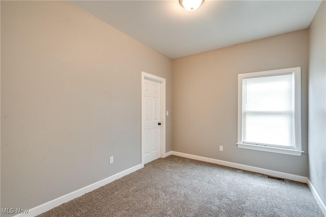 12826 Harvard Ave, Cleveland, OH 44105 - carpeted empty room featuring baseboards