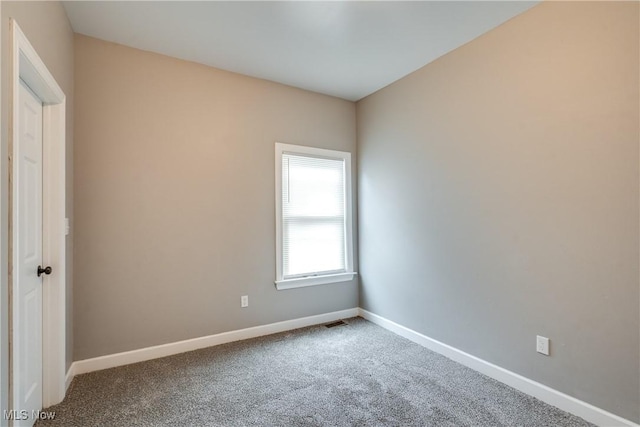12826 Harvard Ave, Cleveland, OH 44105 - carpeted empty room featuring baseboards
