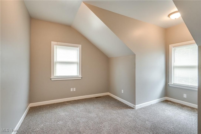 12826 Harvard Ave, Cleveland, OH 44105 - additional living space featuring healthy amount of natural light, carpet flooring, and vaulted ceiling