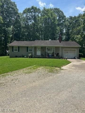 66421 Wolfs Den Rd, Cambridge, OH 43725 - single story home featuring driveway, a garage, a front yard, a chimney, and covered porch
