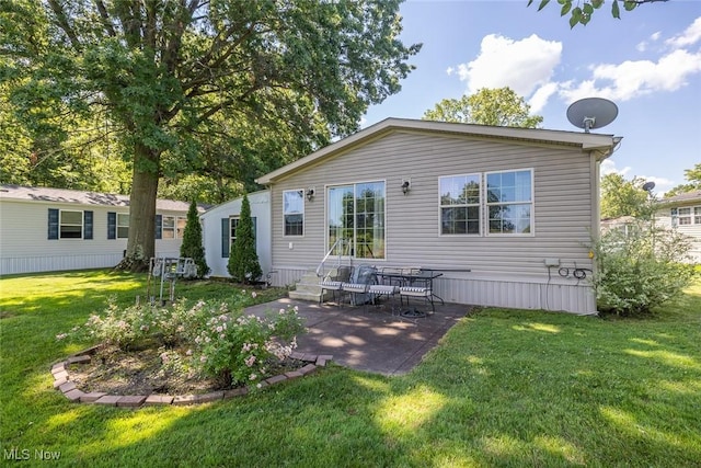 19 Pageant Ln, Olmsted Twp, OH 44138 - rear view of property featuring a lawn and a patio area