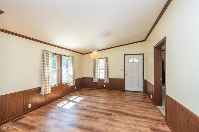 19 Pageant Ln, Olmsted Twp, OH 44138 - entryway with wainscoting, wooden walls, wood finished floors, and ornamental molding
