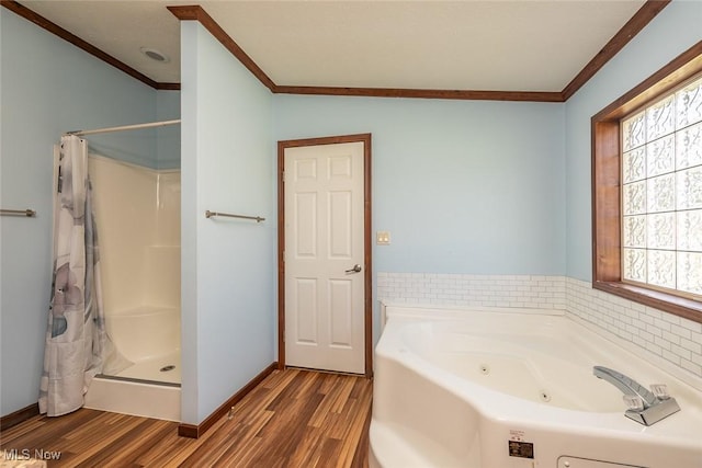 19 Pageant Ln, Olmsted Twp, OH 44138 - full bathroom featuring ornamental molding, a tub with jets, wood finished floors, and a shower stall