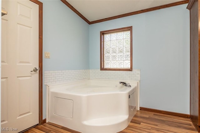19 Pageant Ln, Olmsted Twp, OH 44138 - bathroom featuring crown molding, a bath, and wood finished floors