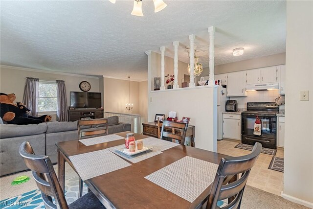 530 N Scranton St, Ravenna, OH 44266 - dining area with a chandelier and a textured ceiling