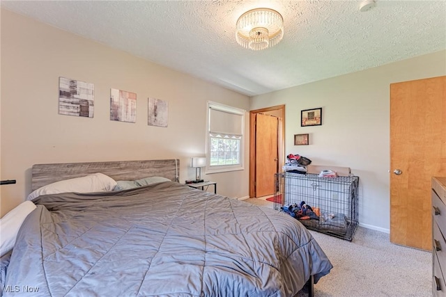 530 N Scranton St, Ravenna, OH 44266 - carpeted bedroom with a textured ceiling and baseboards