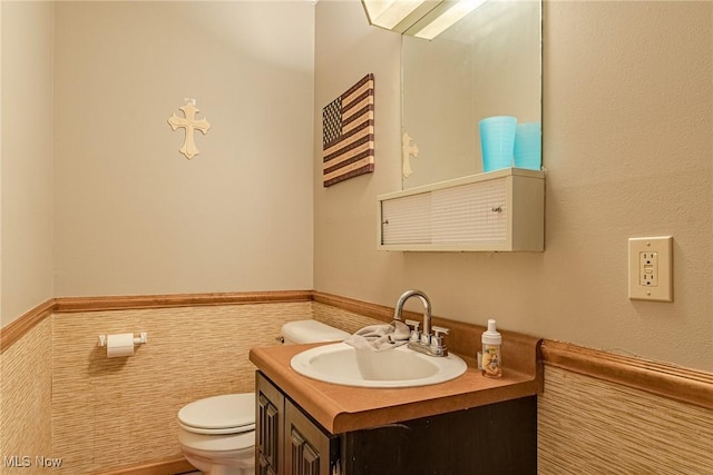 530 N Scranton St, Ravenna, OH 44266 - bathroom featuring a wainscoted wall, vanity, and tile walls