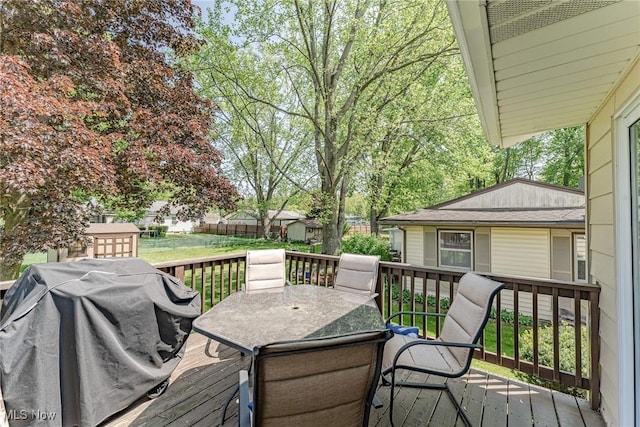 530 N Scranton St, Ravenna, OH 44266 - deck with outdoor dining area, grilling area, and a storage shed
