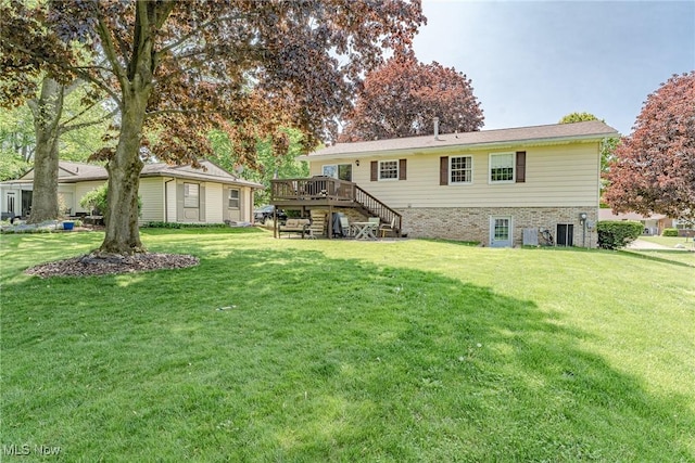 530 N Scranton St, Ravenna, OH 44266 - rear view of house with stairway, a deck, and a lawn